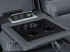 Close Up of Drop-down table with Cup Holders & Plug Socket of recliner electric leather sofa in grey  | siena